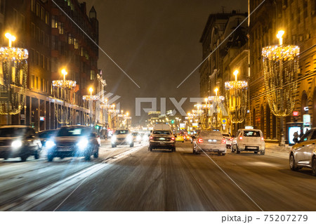 cars on Tverskaya street at snow winter night cars on Tverskaya street at snow winter night 75207279