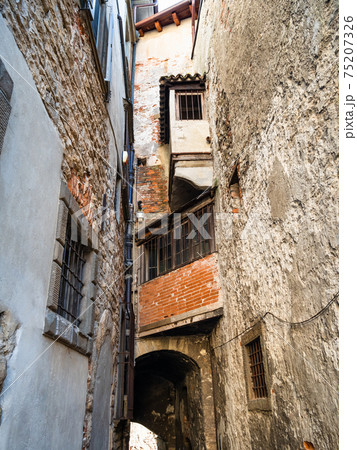 old apartment houses over narrow medieval street 75207326