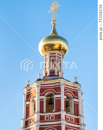 bell tower of Church lit by morning sun in Moscow 75208256