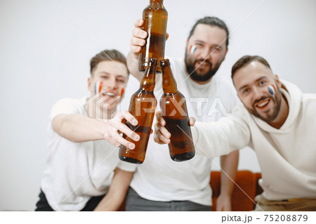 Group of fans are watching a soccer moment on the TV 75208879