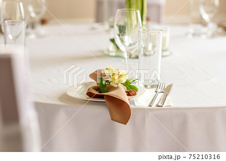 Beautiful decoration of the wedding holiday with flowers and greenery with florist decoration 75210316