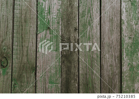 old shabby gray fence made of wooden boards old shabby gray fence made of wooden boards 75210385