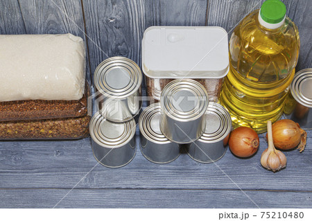 canned food and vegetable oil on a wooden shelf, food crisis canned food and vegetable oil on a wooden shelf, food crisis 75210480