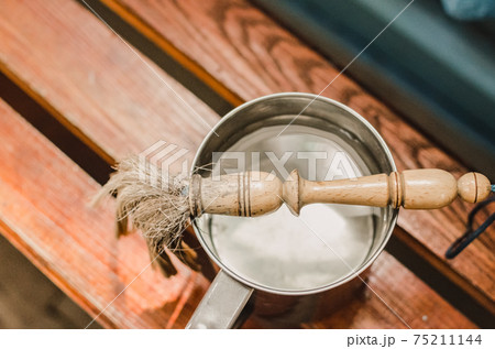 The priest's money lies on the Big mug with water. The priest's money lies on the Big mug with water. 75211144