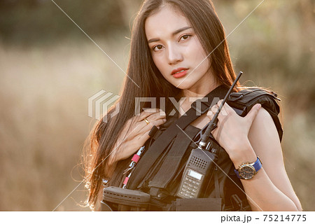 Portrait of beautiful sexy woman with shotgun and Pistol in a shooting computer 75214775