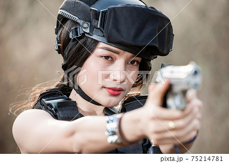 Portrait of beautiful sexy woman with shotgun and Pistol in a shooting computer Portrait of beautiful sexy woman with shotgun and Pistol in a shooting computer 75214781