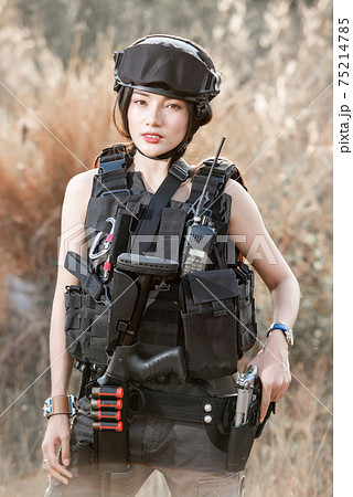 Portrait of beautiful sexy woman with shotgun and Pistol in a shooting computer Portrait of beautiful sexy woman with shotgun and Pistol in a shooting computer 75214785
