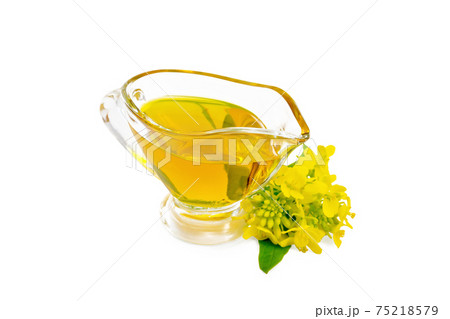 Oil mustard in gravy boat with flower Oil mustard in gravy boat with flower 75218579