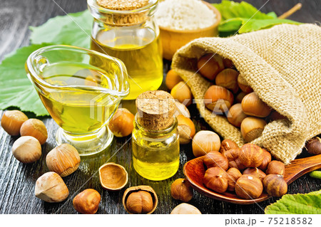 Oil hazelnut in vial on black board 75218582