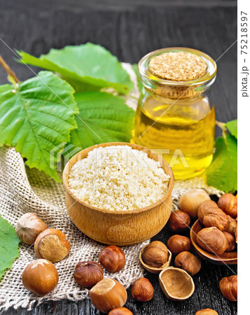 Flour in bowl with oil on dark board 75218597