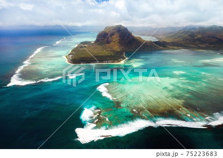 A bird's-eye view of Le Morne Brabant, a UNESCO world heritage site.Coral reef of the island of Mauritius.Storm cloud 75223683