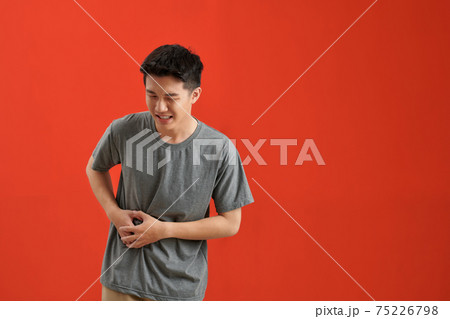 Man Stomach Ache over red Man Stomach Ache over red 75226798
