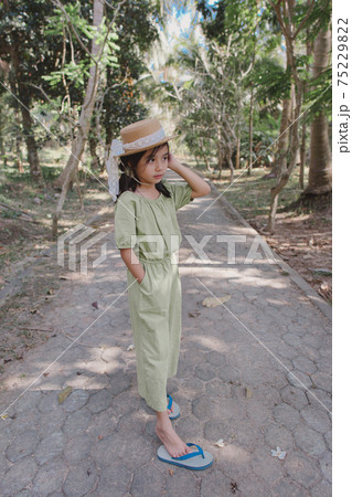 little girl in dress standing and posing little girl in dress standing and posing 75229822