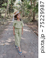 little girl in dress standing and posing 75229987