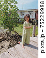 little girl in dress standing and posing 75229988