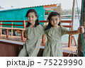 Portrait of Two little girls in beautiful dresses 75229990