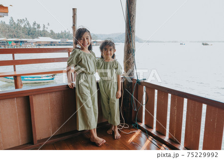 Portrait of Two little girls in beautiful dresses 75229992