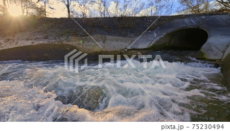 Large sewage tunnel with filth flowing out Large sewage tunnel with filth flowing out 75230494