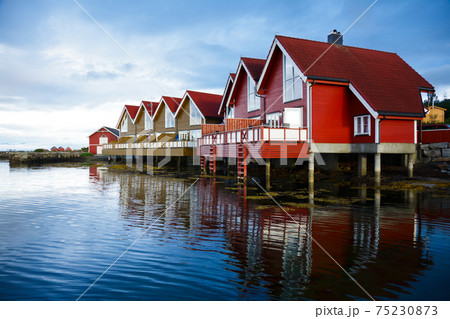 Camping cabins on a fjord 75230873