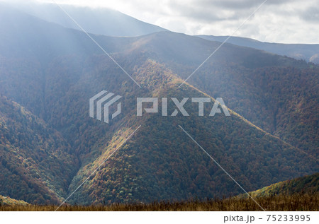 Black pyramid. Mountain in the form of a triangle. Mountainous landscape. 75233995