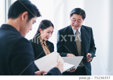 asian group meeting business people. Senior tranning Asian Businessman. Group discussion. Happy faces of suitma. Working for success in office. 75236357