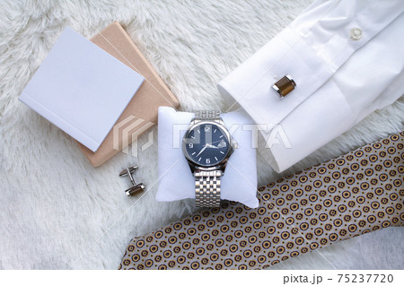 Flat lay with men s luxury wrist watch tie