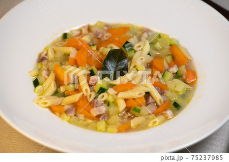 Fresh Vegetable soup and pasta in a white bowl Fresh Vegetable soup and pasta in a white bowl 75237985