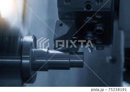 The CNC lathe machine cutting the metal cone shape parts. The CNC lathe machine cutting the metal cone shape parts. 75238191