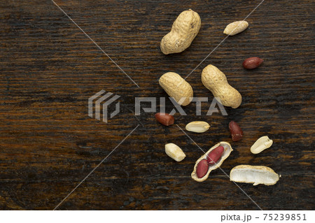 Top view of Peanuts hulls nut shell and peeled peanuts Top view of Peanuts hulls nut shell and peeled peanuts 75239851