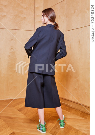 Indoor portrait of a young beautiful fashionable woman wearing stylish accessories. Female fashion, beauty and advertisement concept. Copy space for text. 75240324