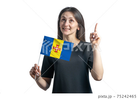 Happy young white woman holding flag of Madeira and points thumbs up isolated on a white background Happy young white woman holding flag of Madeira and points thumbs up isolated on a white background 75242465