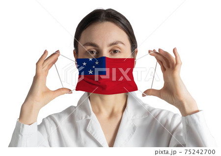 Respirator with flag of Samoa Doctor puts on medical face mask isolated on white background 75242700