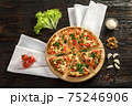 Delicious pizza on a wooden cutting board 75246906
