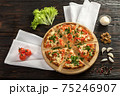 Delicious pizza on a wooden cutting board 75246907