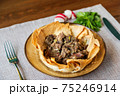 Appetizing meat in baked lavash according 75246914