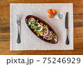 Edible flowers salad with oil, onion and salt. Jonjoli - delicious Georgian appetizer salad. 75246929