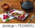 A piece of tender crispy strudel with apples 75246931