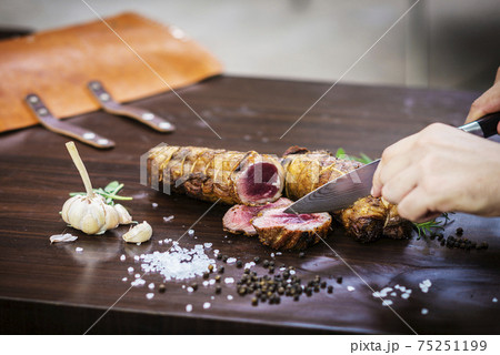 serving carving roast pork meat roll meal in rustic style serving carving roast pork meat roll meal in rustic style 75251199
