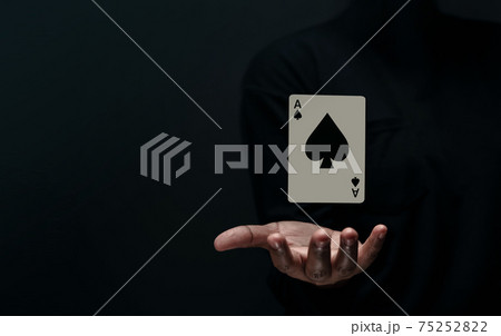 Ace Spade Playing Card. Levitating Poker Card on Hand. Front View. Closeup and Dark Tone 75252822