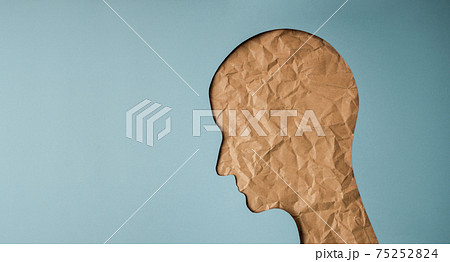 Aging Concept. Shape of Woman Head created by Crumpled Craft Paper Cut. Old Wrinkled Skin Lady. Sadness Female Face Aging Concept. Shape of Woman Head created by Crumpled Craft Paper Cut. Old Wrinkled Skin Lady. Sadness Female Face 75252824