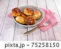 Several juicy fish cakes for a family dinner on the table 75258150