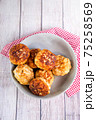 Several juicy fish cakes for a family dinner on the table 75258569