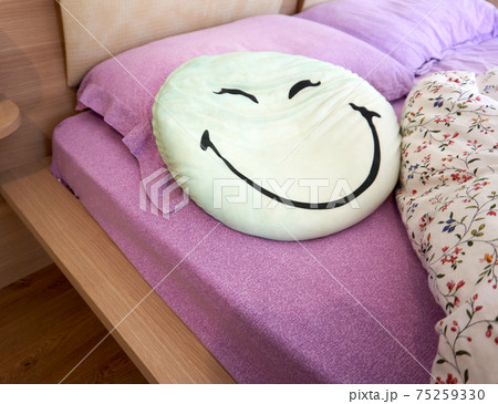 Undone bed in the morning in a cozy bedroom 75259330