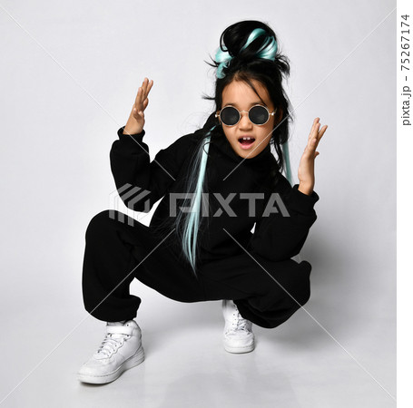 Attractive young korean woman wearing black hoodie Attractive young korean woman wearing black hoodie 75267174