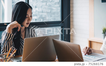 Young business teamwork using laptop with business report document and Brainstorming Planning Partnership Young business teamwork using laptop with business report document and Brainstorming Planning Partnership 75268176