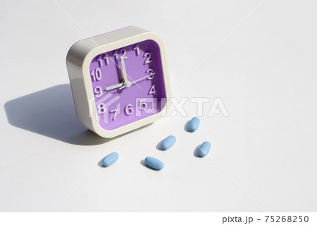 PrEP ( Pre-Exposure Prophylaxis) used to prevent HIV with clock on white 75268250