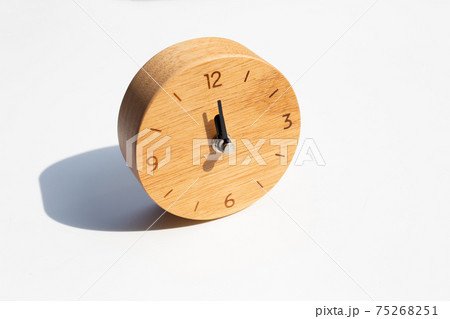Wooden clock on white background. Wooden clock on white background. 75268251