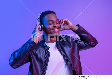Music Lover. Handsome Black Guy In Wireless Headphones Listening His Favorite Songs 75270629