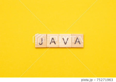 Word JAVA made from wooden letters on yellow background. Modern Programming language for software development 75271963
