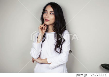 young asian woman doctor in white uniform gesturing positive on gray background, lifestyle healthcare people concept 75275573